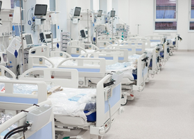 A row of empty hospital beds