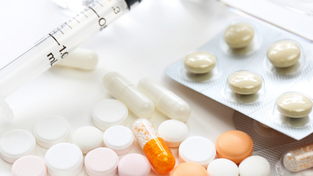 A variety of medications in pill and liquid form