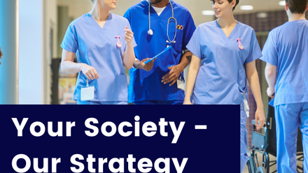 Three young NHS professionals walking through a hospital corridor with the words 'Your Society - Our Strategy' superimposed on a navy block