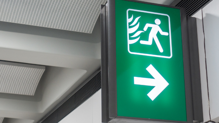 A green fire exit sign.